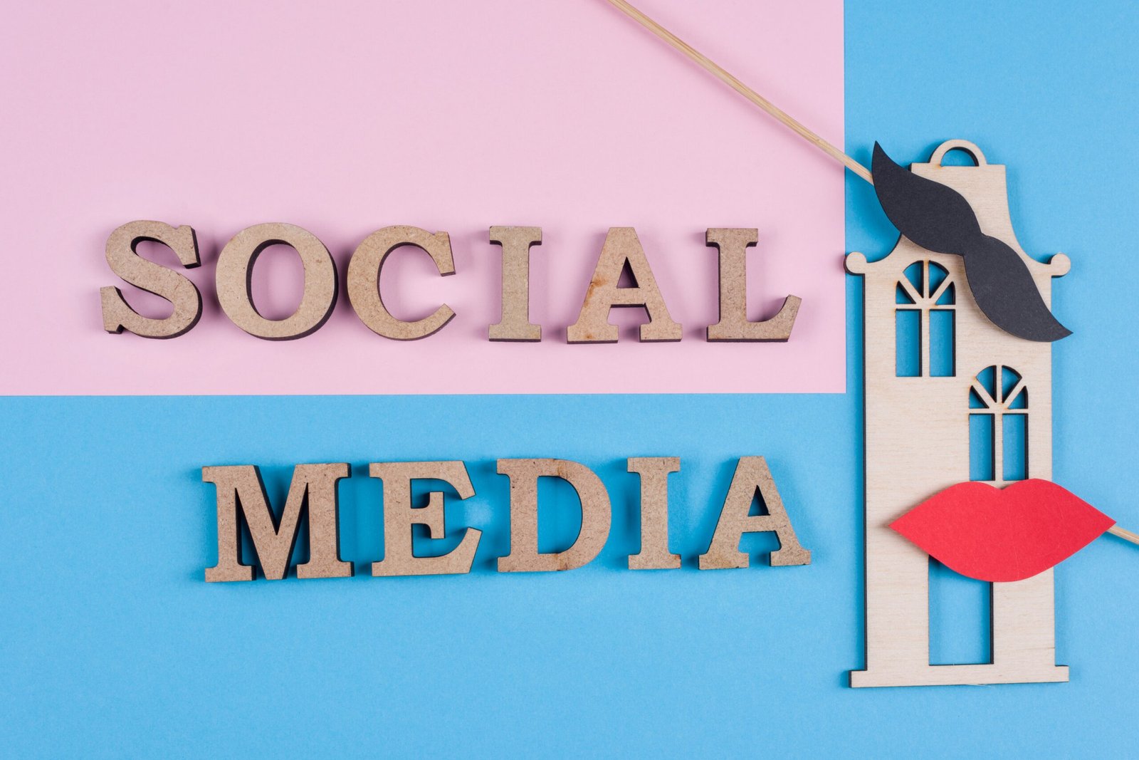 Text social media abstract wooden letters. Blue background with the image of house and pair of friends.